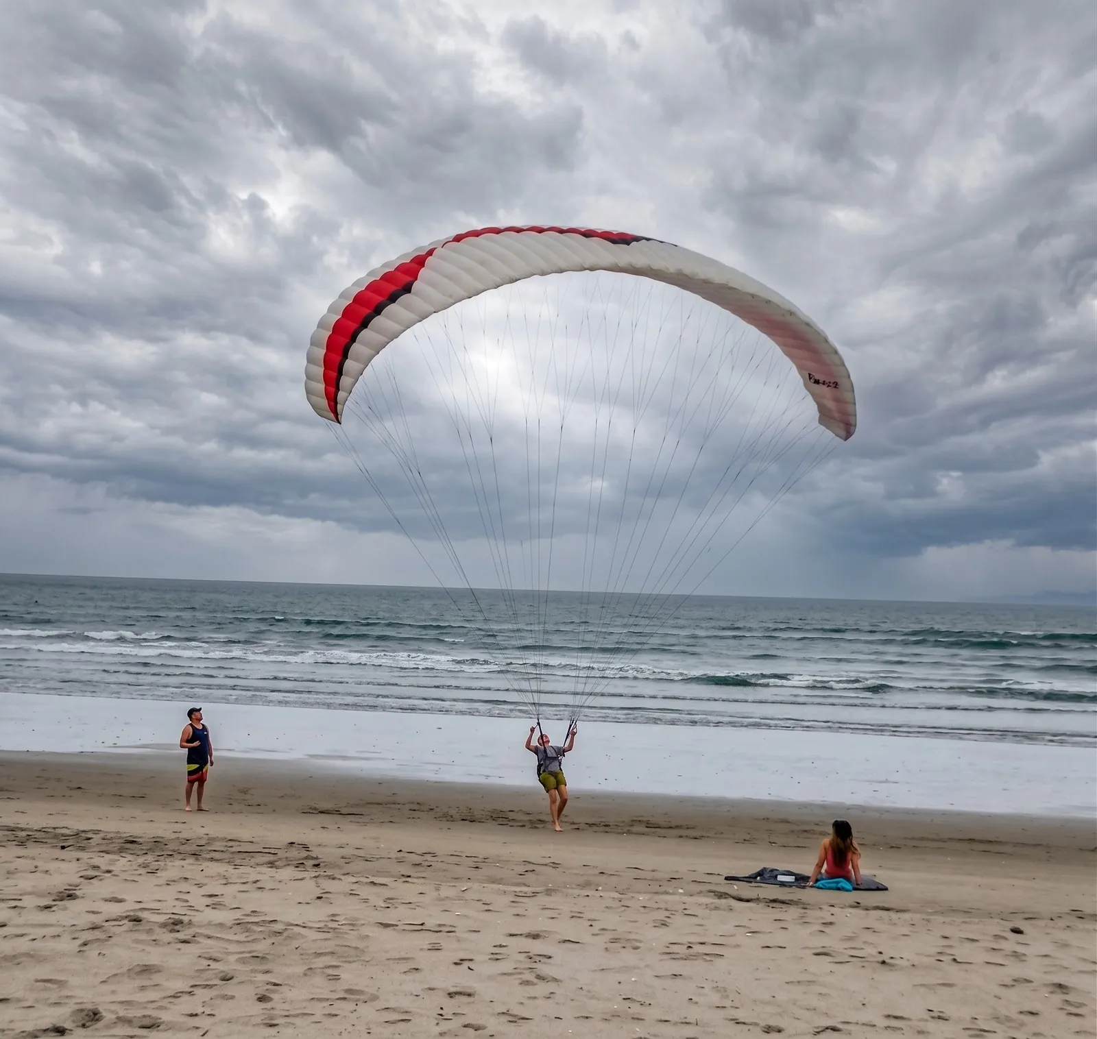 Paraglider taking off from the beach in Canoa, Manabí