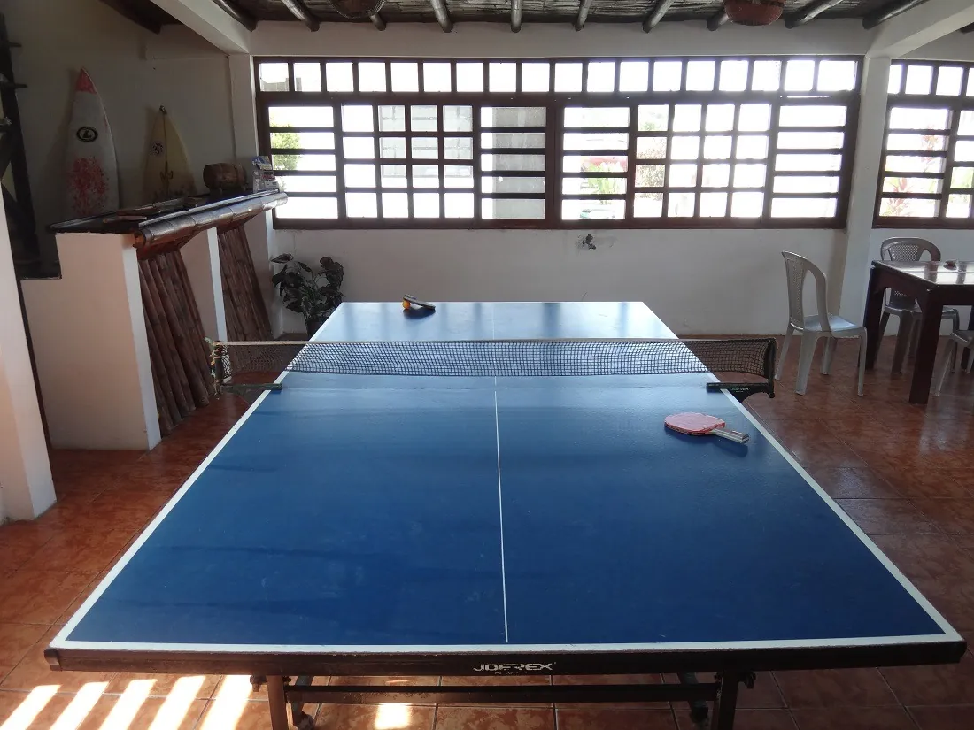 Ping pong table and surfboards in the hotel's common area